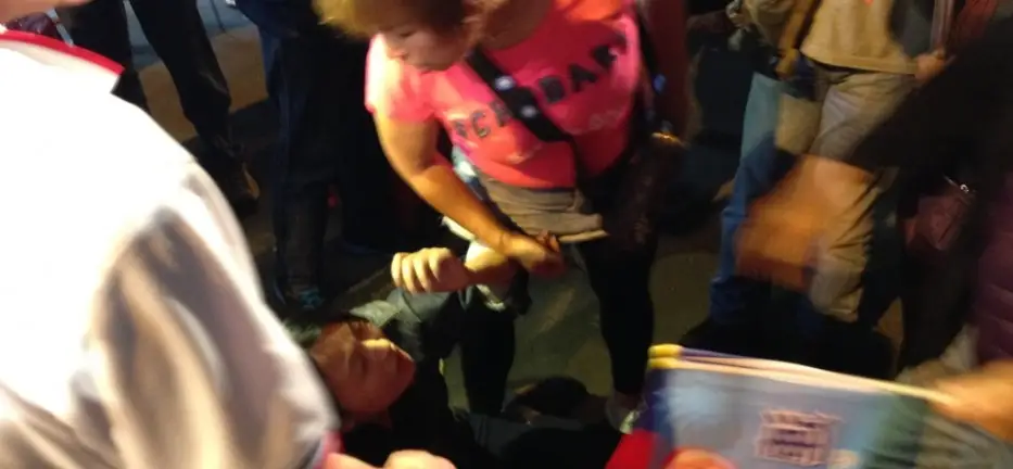 Lien Supporters Turn Violent, Attack Protesters